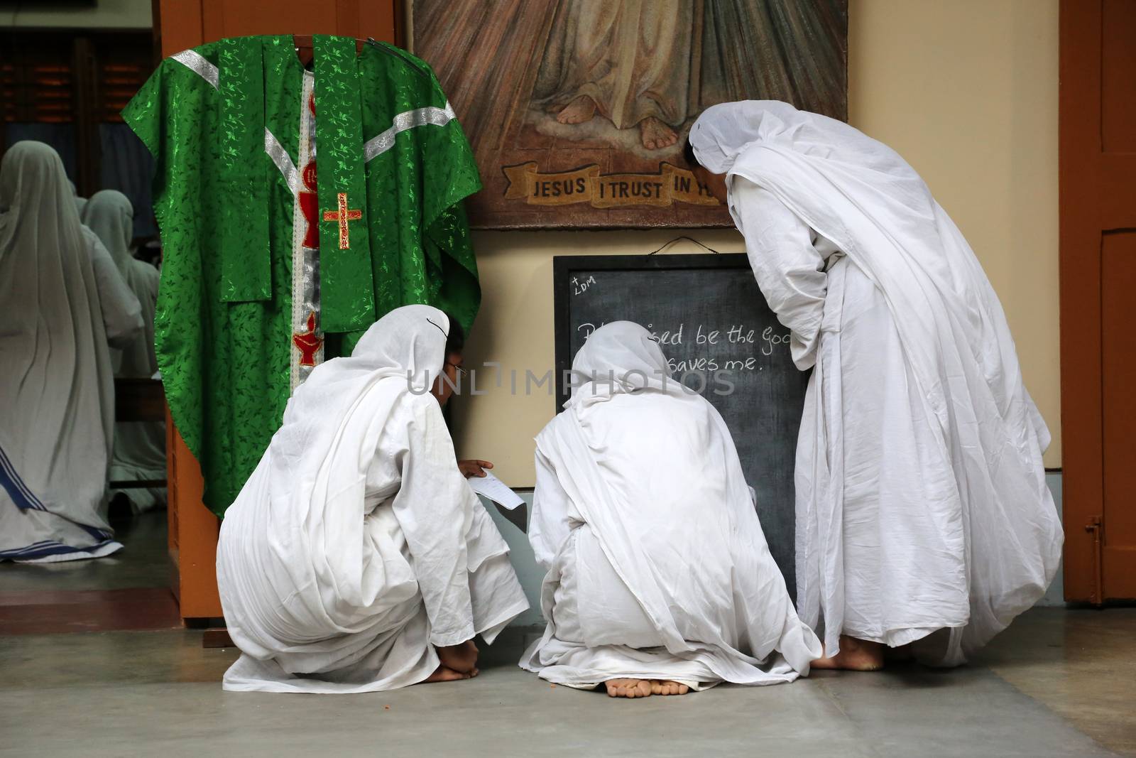 Sister of Missionaries of Charity preparing for prayer in Motherhouse, Kolkata, India