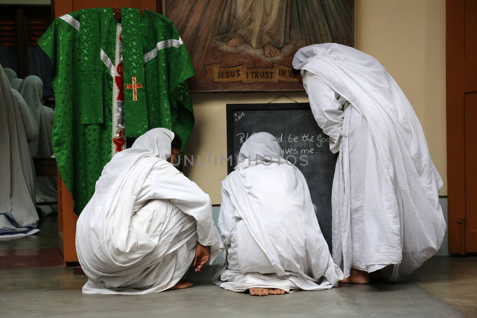 Sister of Missionaries of Charity preparing for prayer in Motherhouse, Kolkata, India