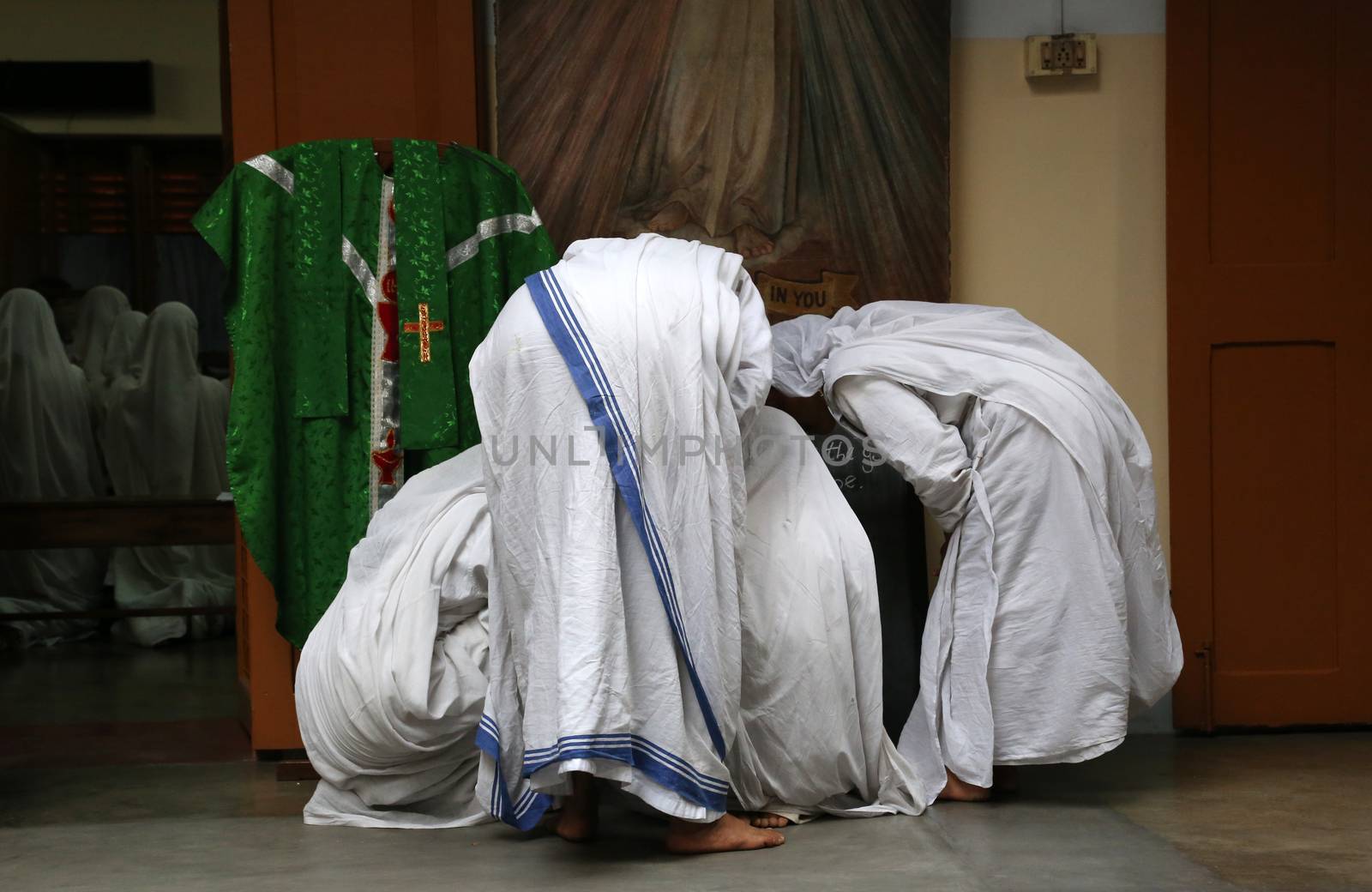 Sister of Missionaries of Charity preparing for prayer in Motherhouse, Kolkata, India