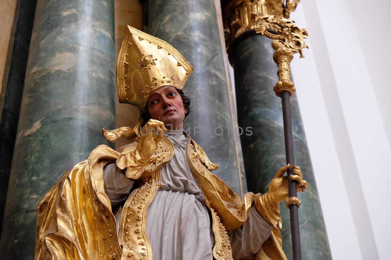 Statue of Saint, Altar in Collegiate church in Salzburg