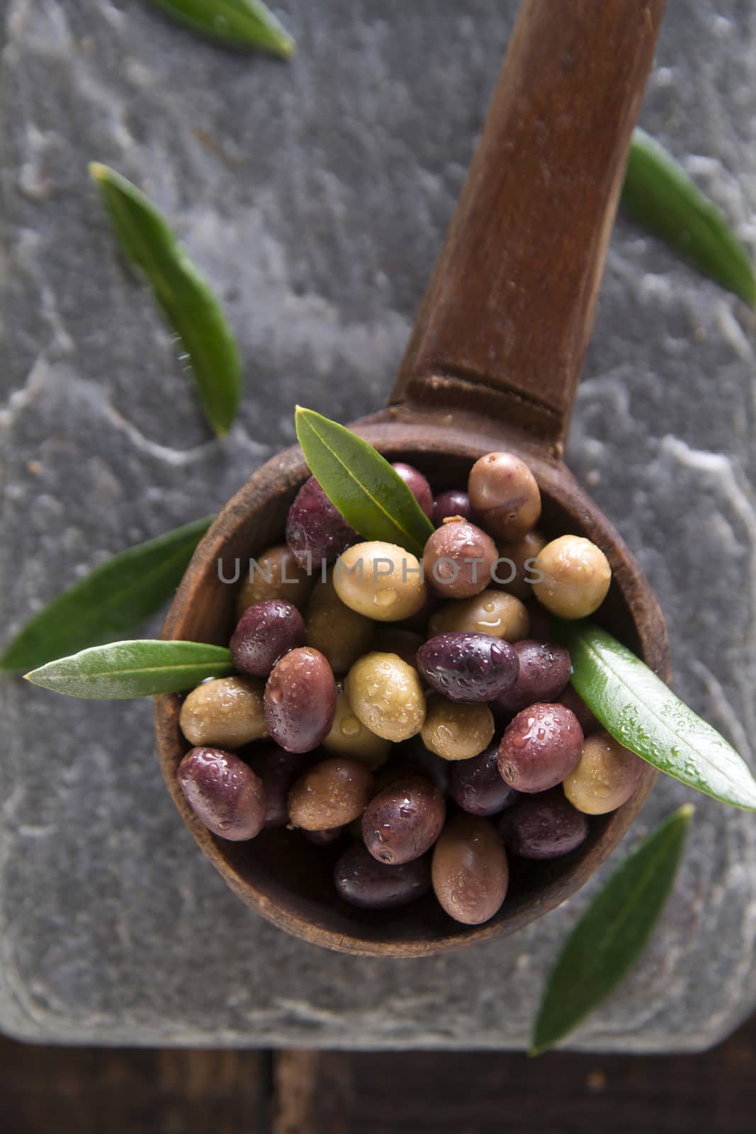 Mixed olives in brine by fotografiche.eu