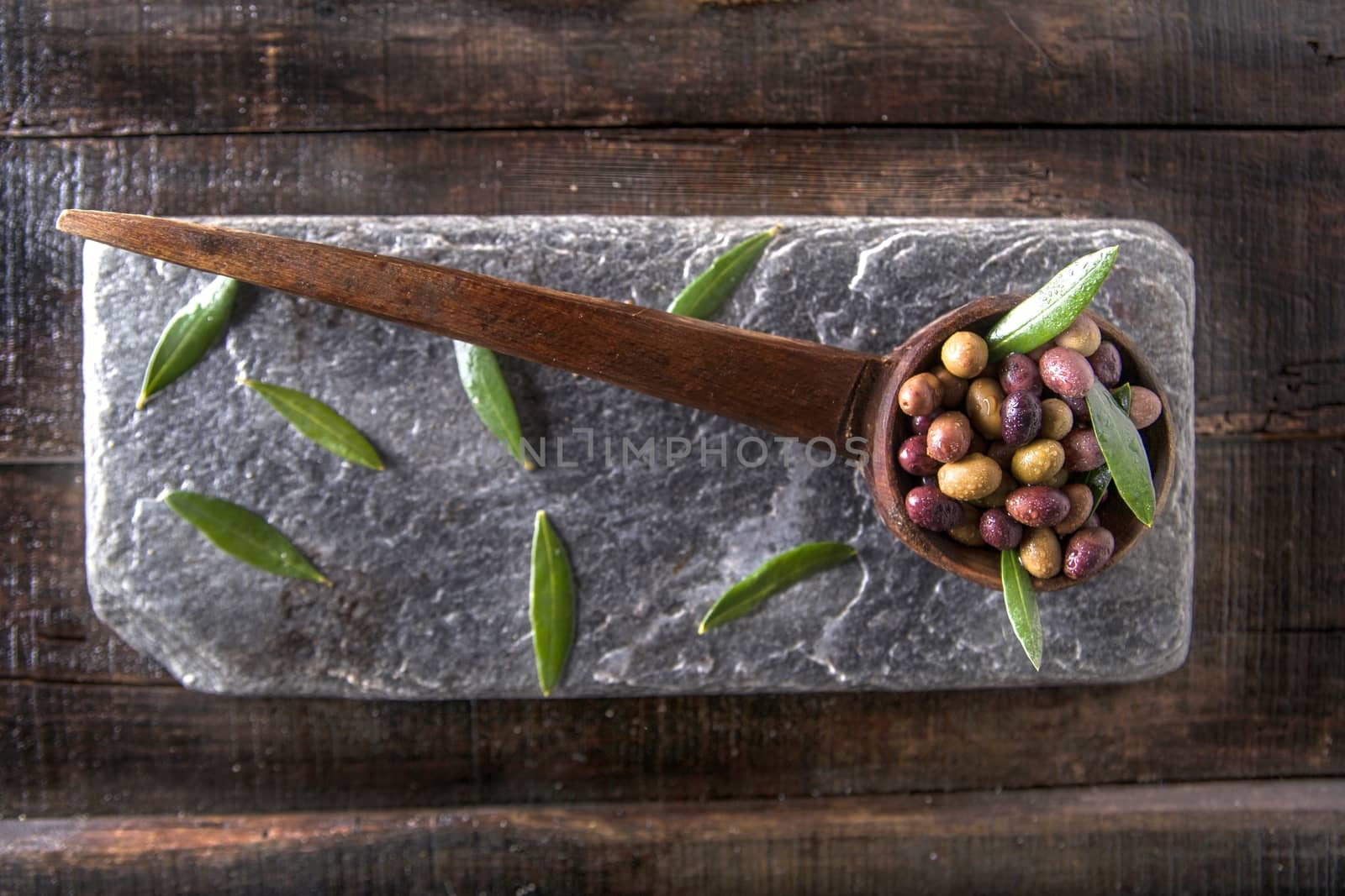 Mixed olives in brine by fotografiche.eu
