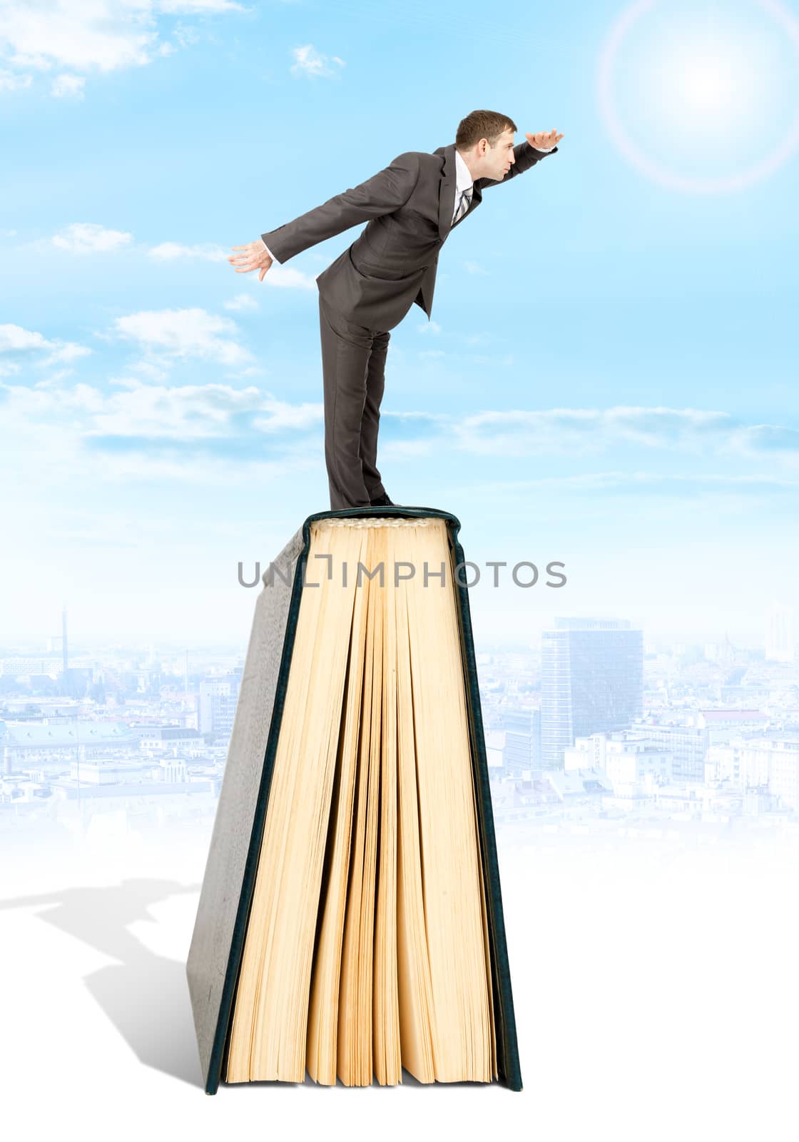 Man staying on books and looking into distance by cherezoff