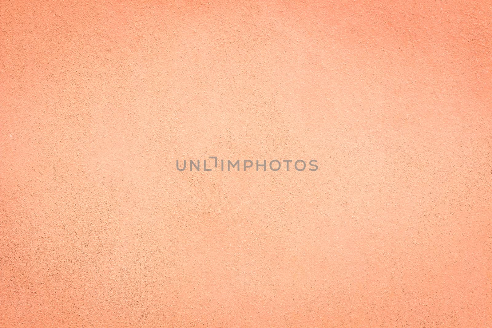 Pink wall background and texture with vignetting and blank copyspace for text or advertising.