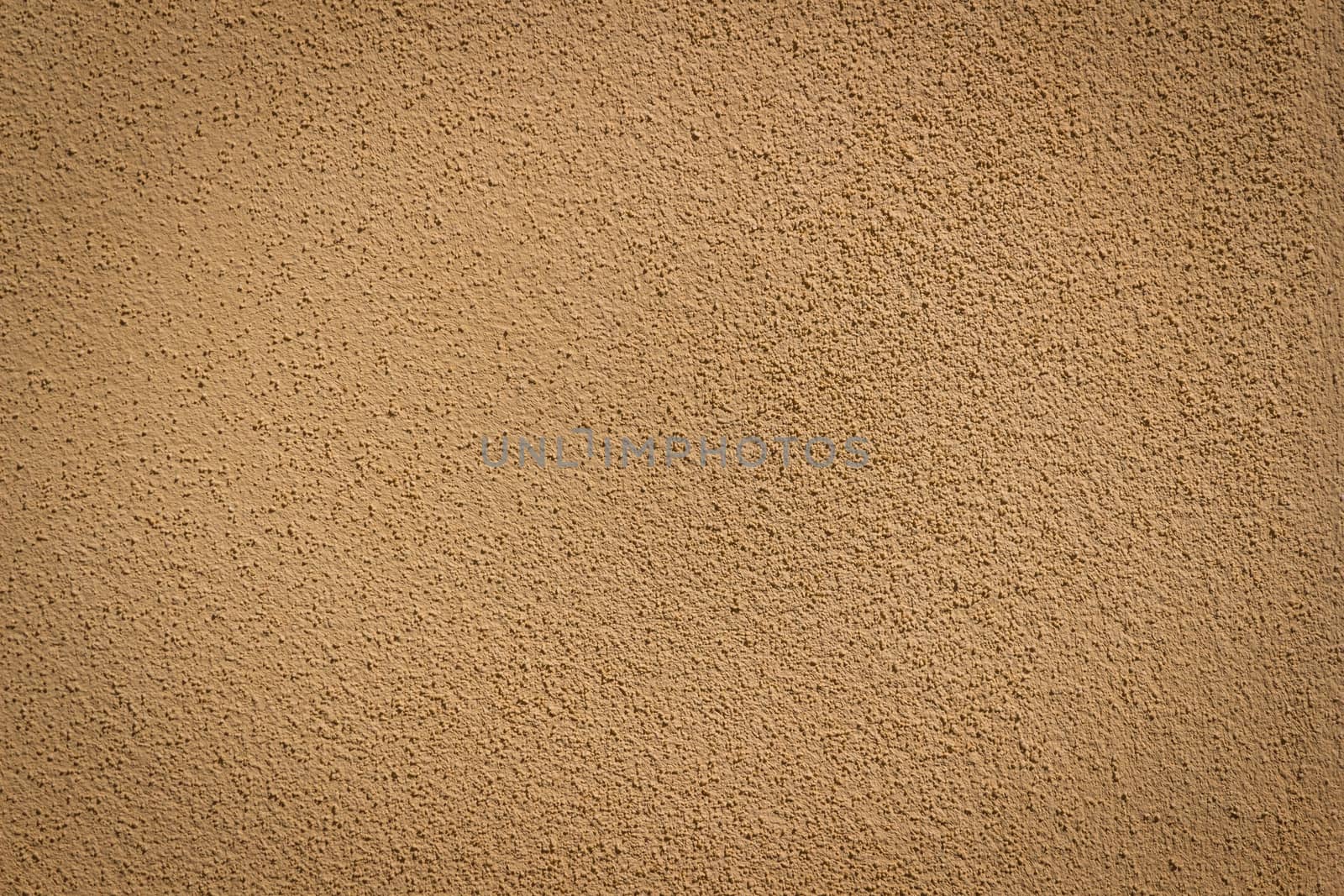 Orange wall background and texture with vignetting and blank copyspace for text or advertising.