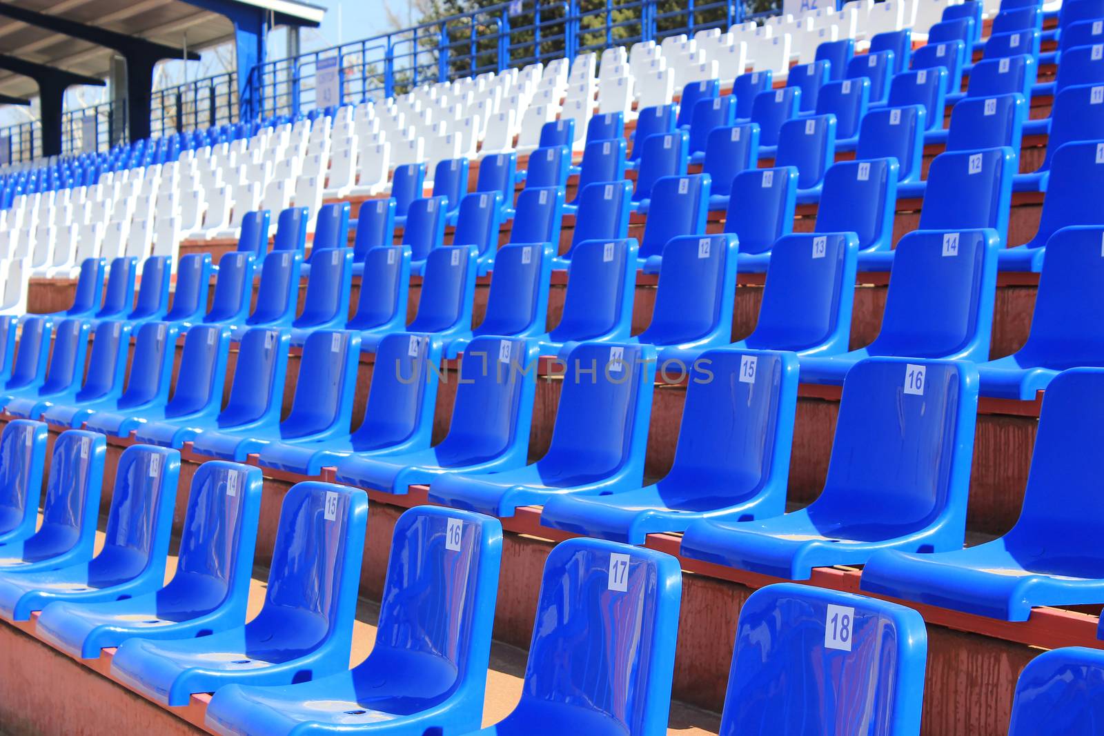 Tribune with folding chairs at small old stadium