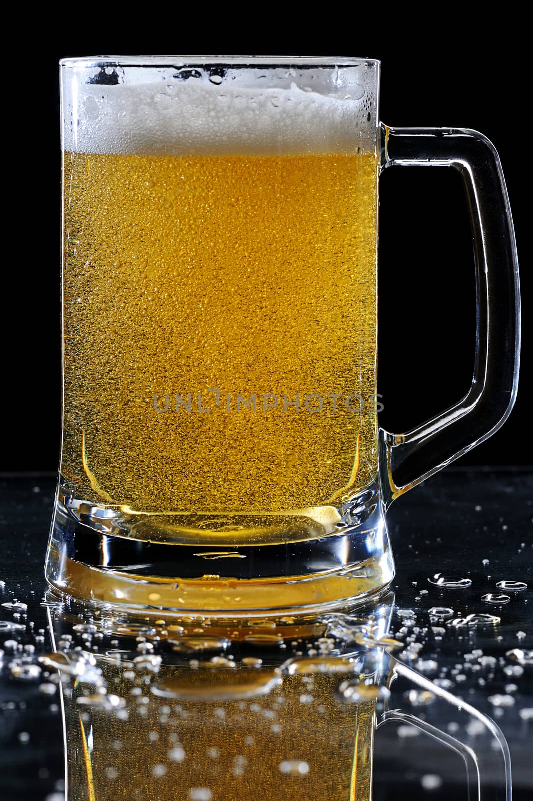 beer glass on wet table with drops