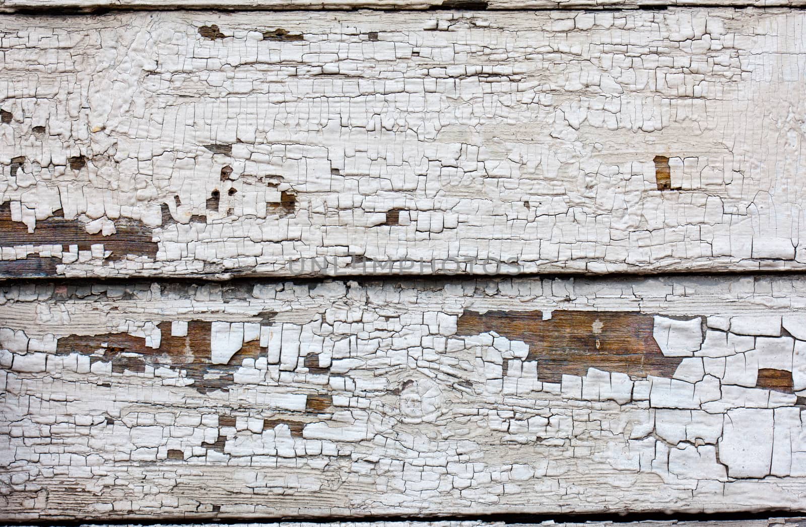 Vintage wood background with peeling paint. close-up