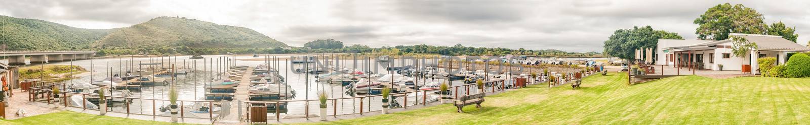 PLETTENBERG BAY, SOUTH AFRICA - MARCH 3, 2016: The harbor of the Plettenberg Bay Angling Club is situated on the down stream side of the N2 bridge on the Keurbooms River