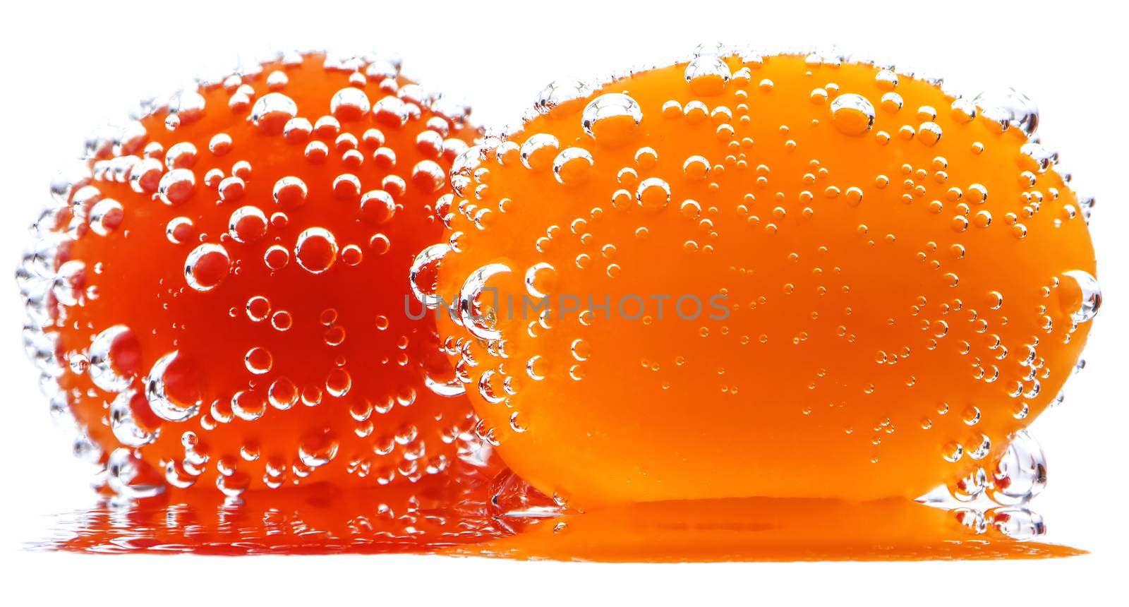 Cherry Tomatoes with gas bubbles. Isolated on a white background.