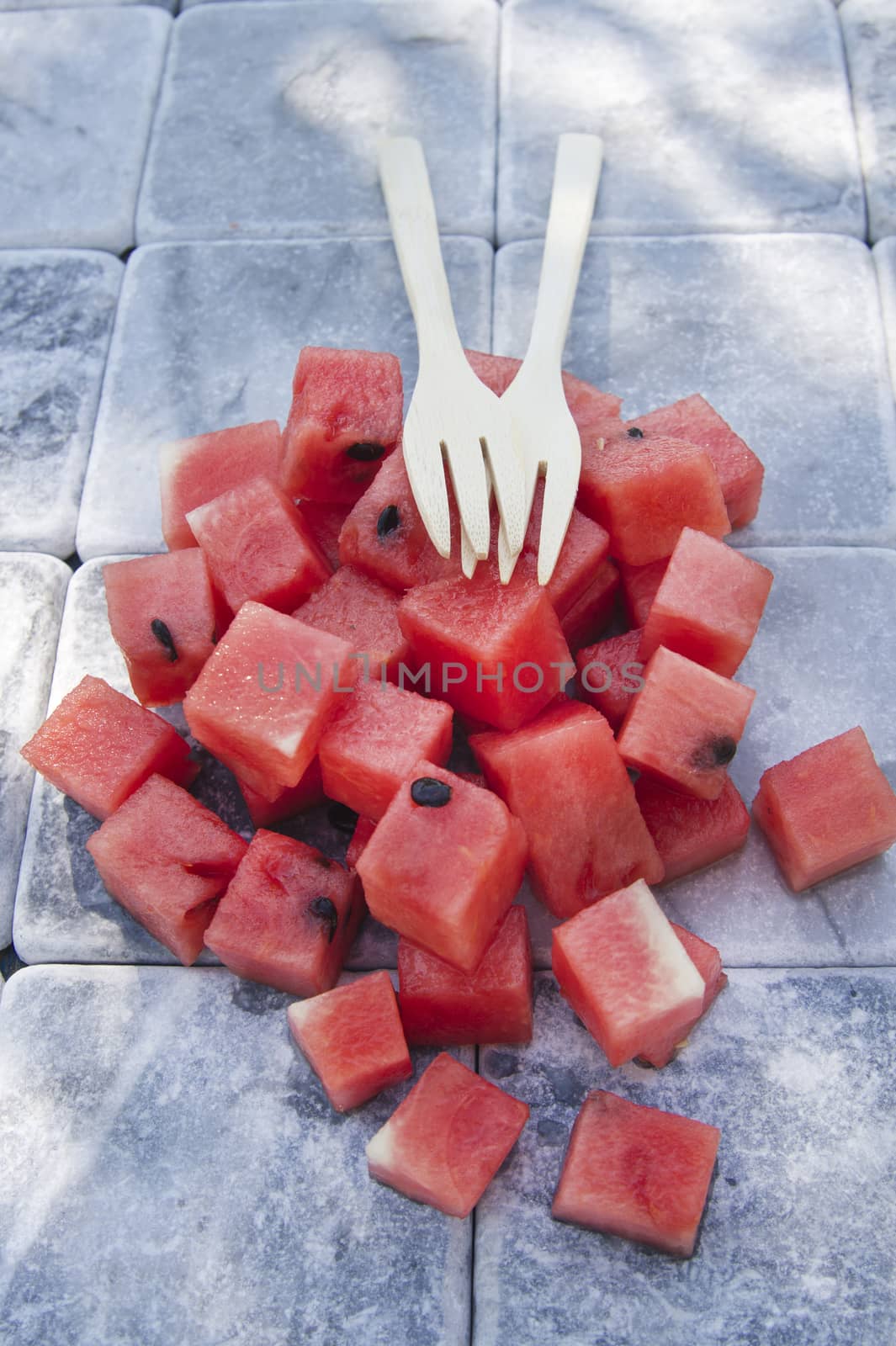 Presentation of a summer dish made of diced watermelon 