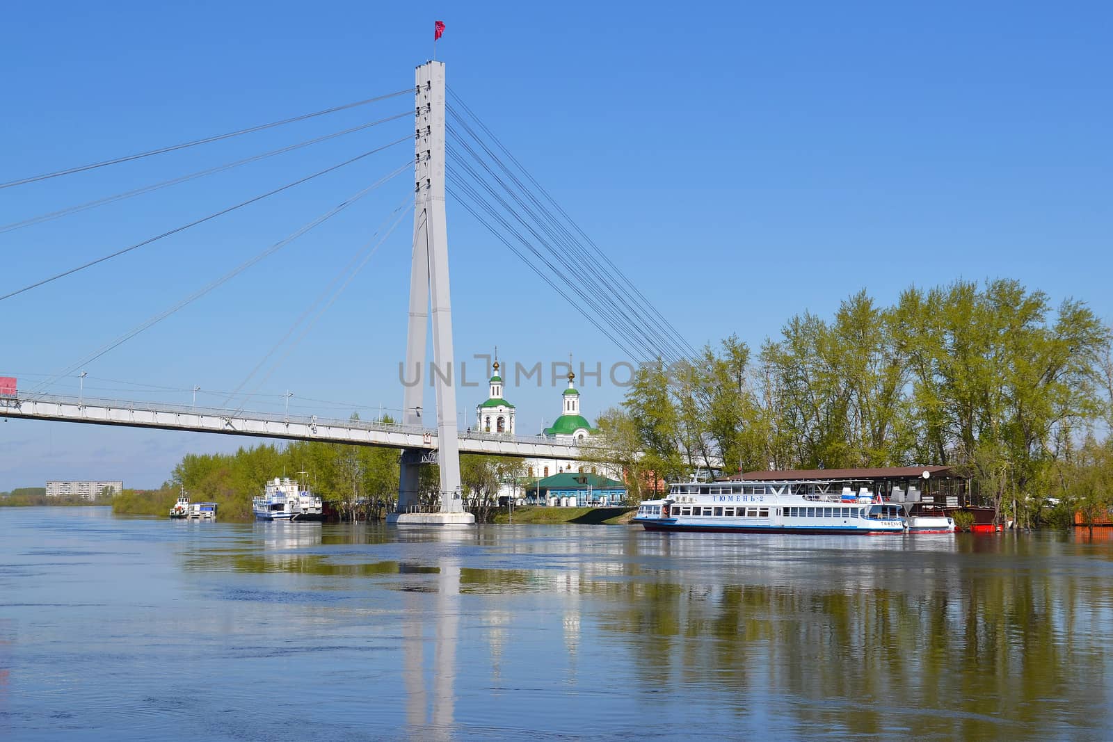 The pedestrian cable-stayed bridge on the Tura River in the city of Tyumen, Russia. May, 2016