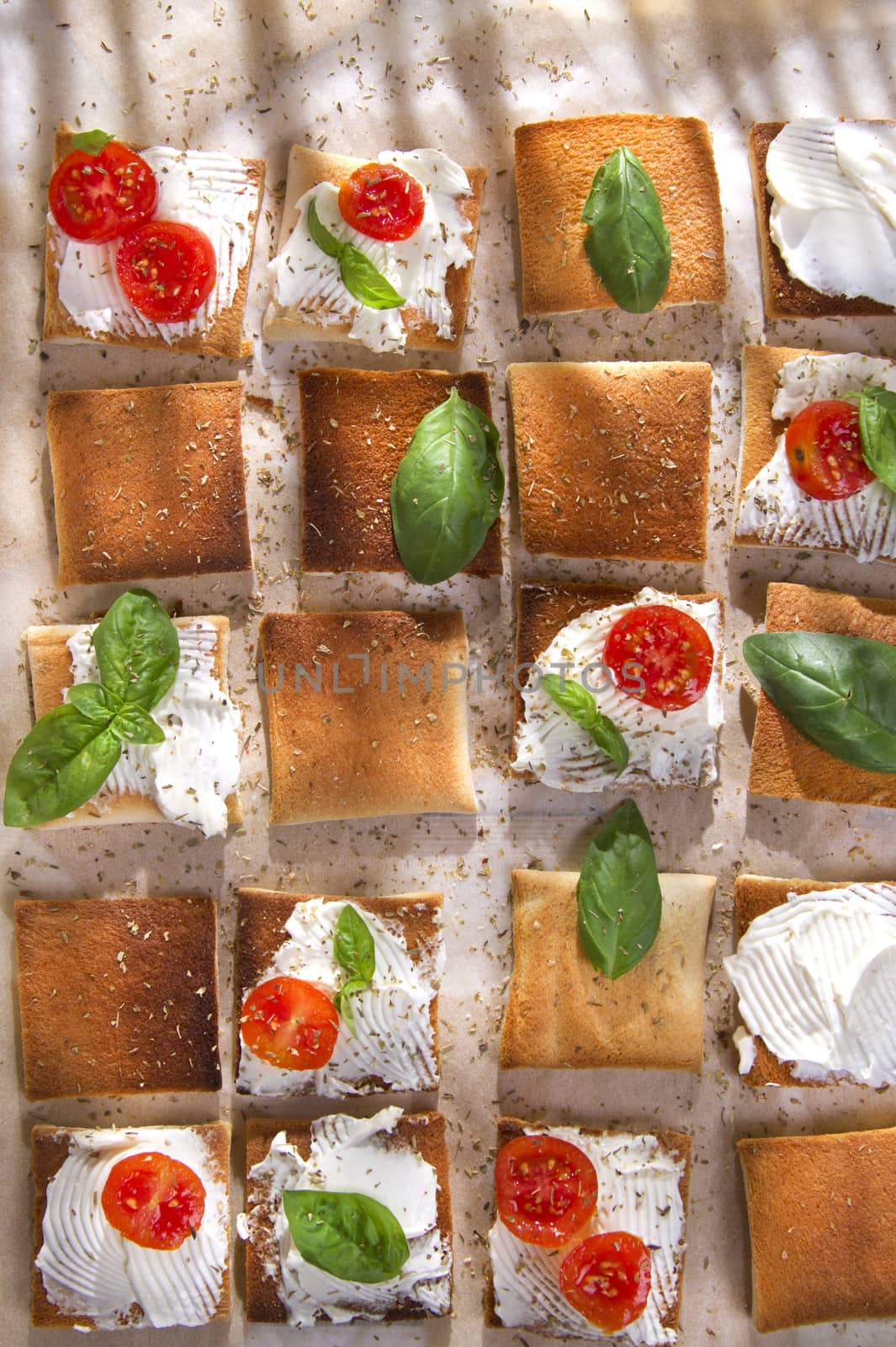 Tricolor cocktail canapes, cheese and tomato salad 