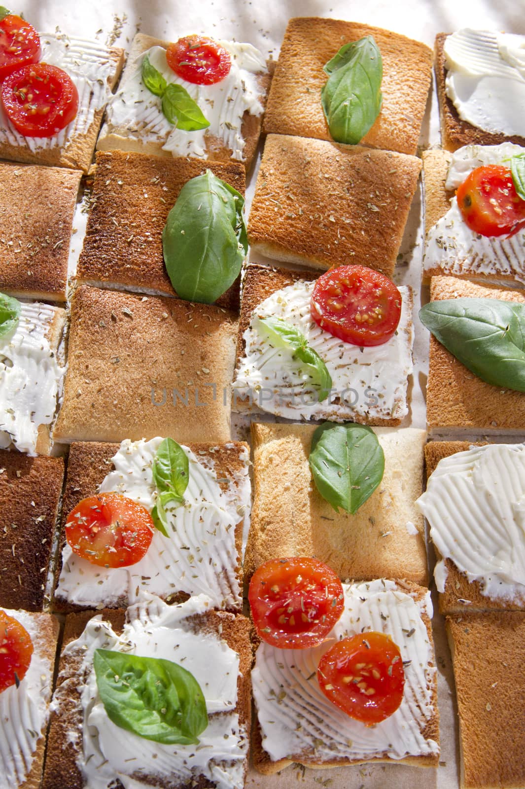 Tricolor cocktail canapes, cheese and tomato salad 