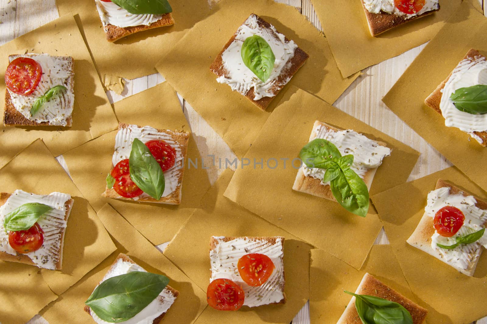 Tricolor cocktail canapes, cheese and tomato salad 