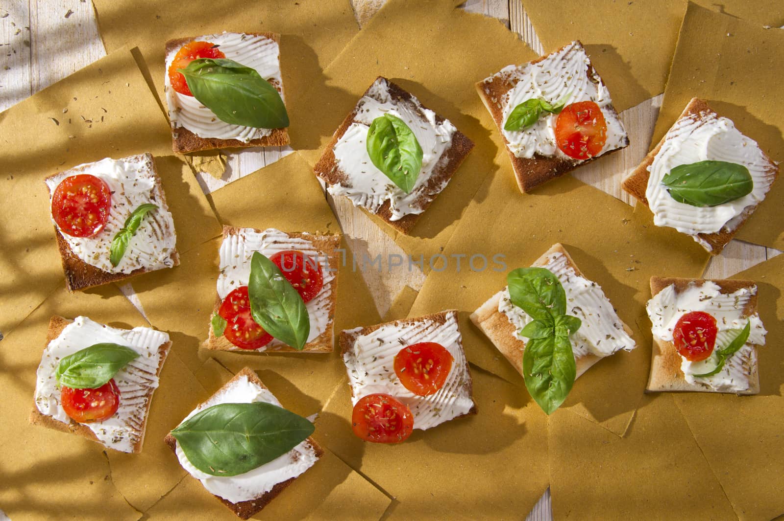 Tricolor cocktail canapes, cheese and tomato salad 