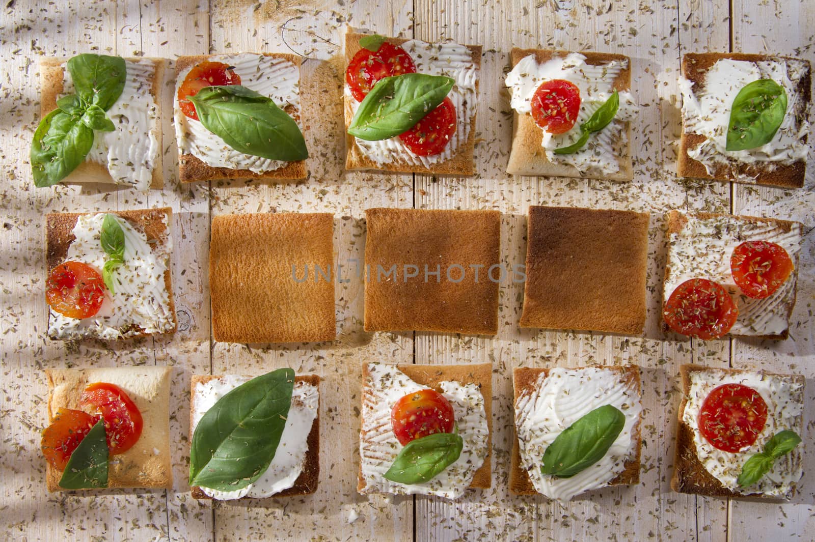 Tricolor cocktail canapes, cheese and tomato salad 