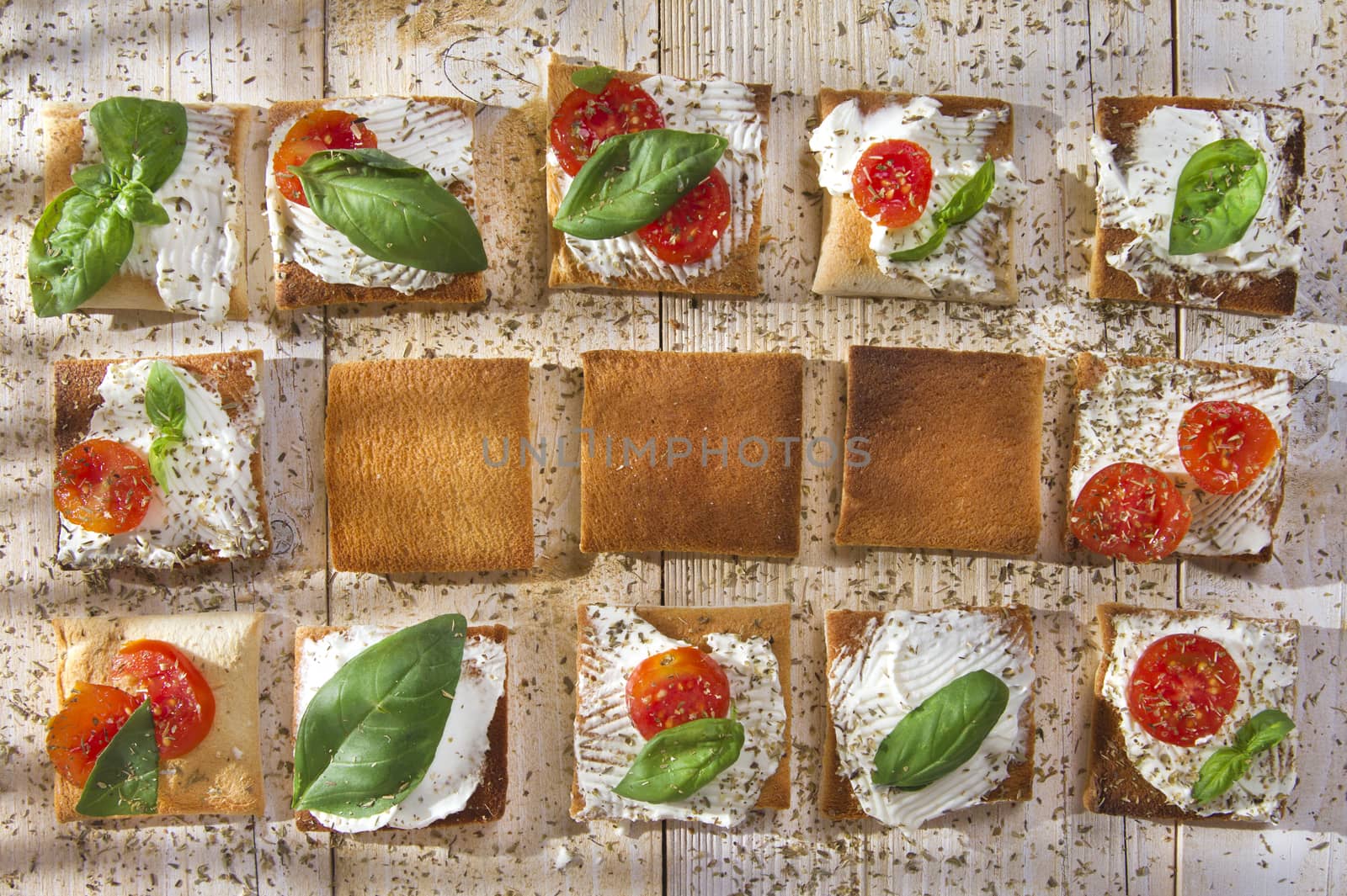 Tricolor cocktail canapes, cheese and tomato salad 