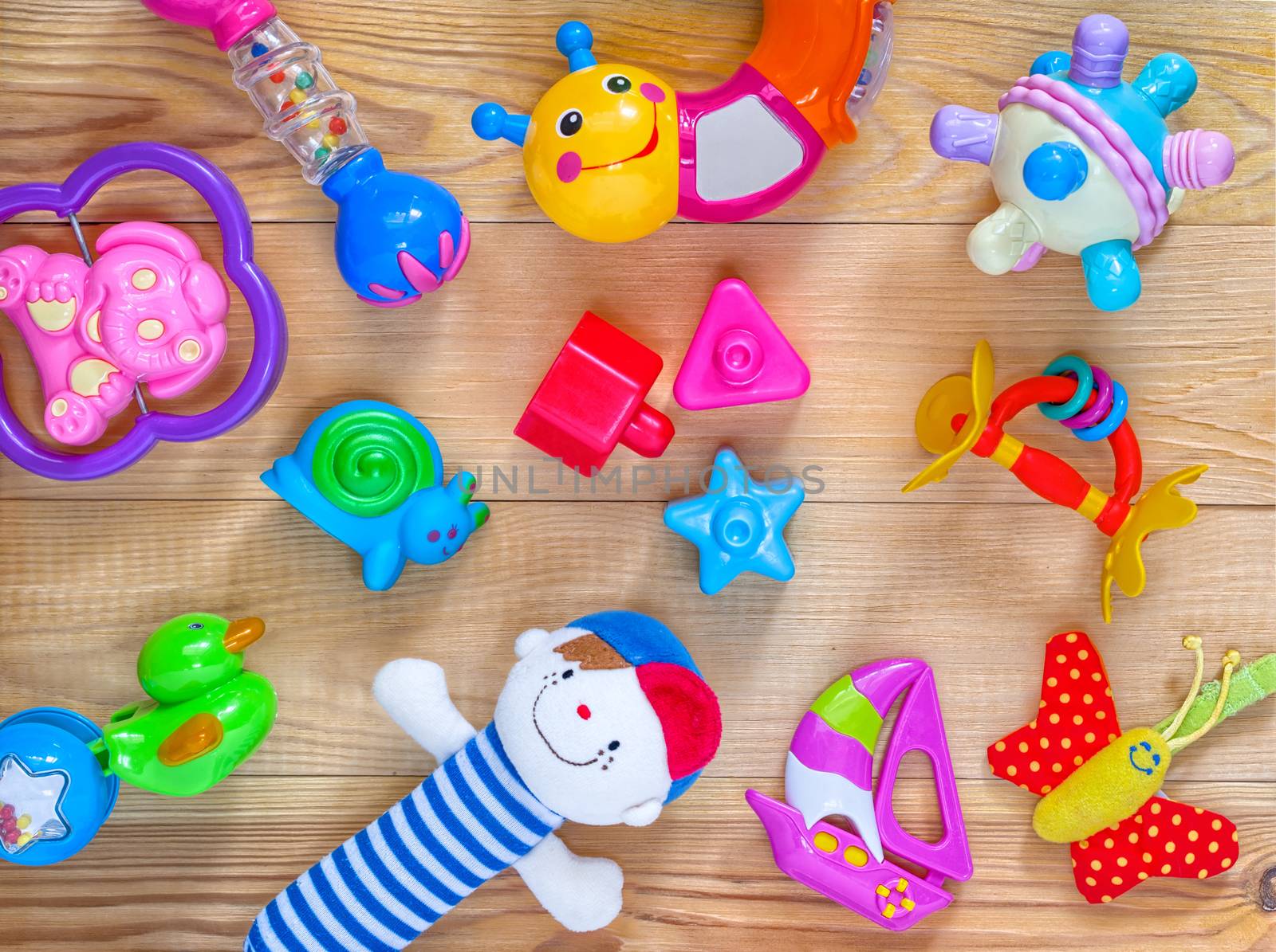 top view or flat lay on colorful toys on light wooden background