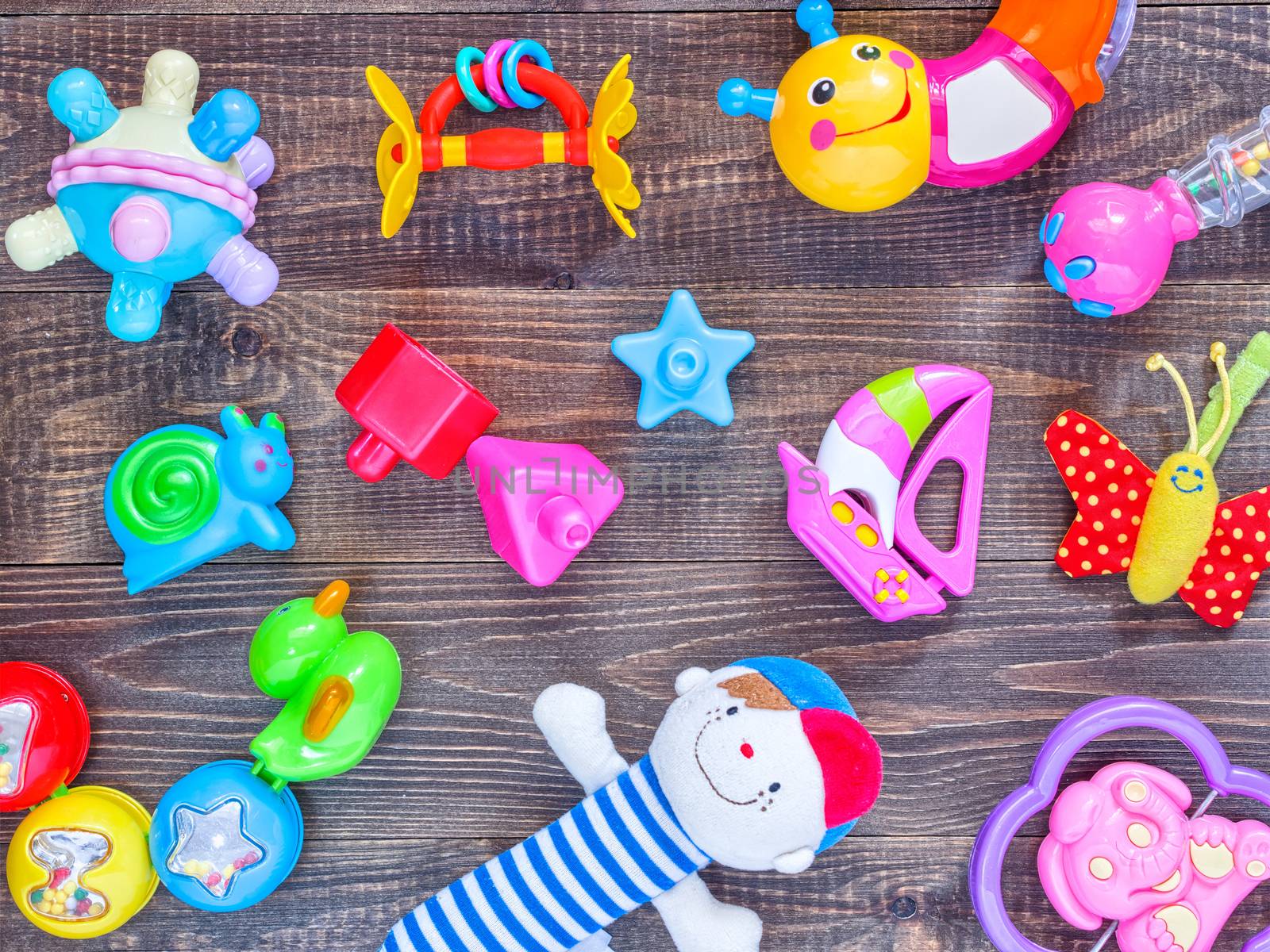 top view or flat lay on colorful toys on wooden background