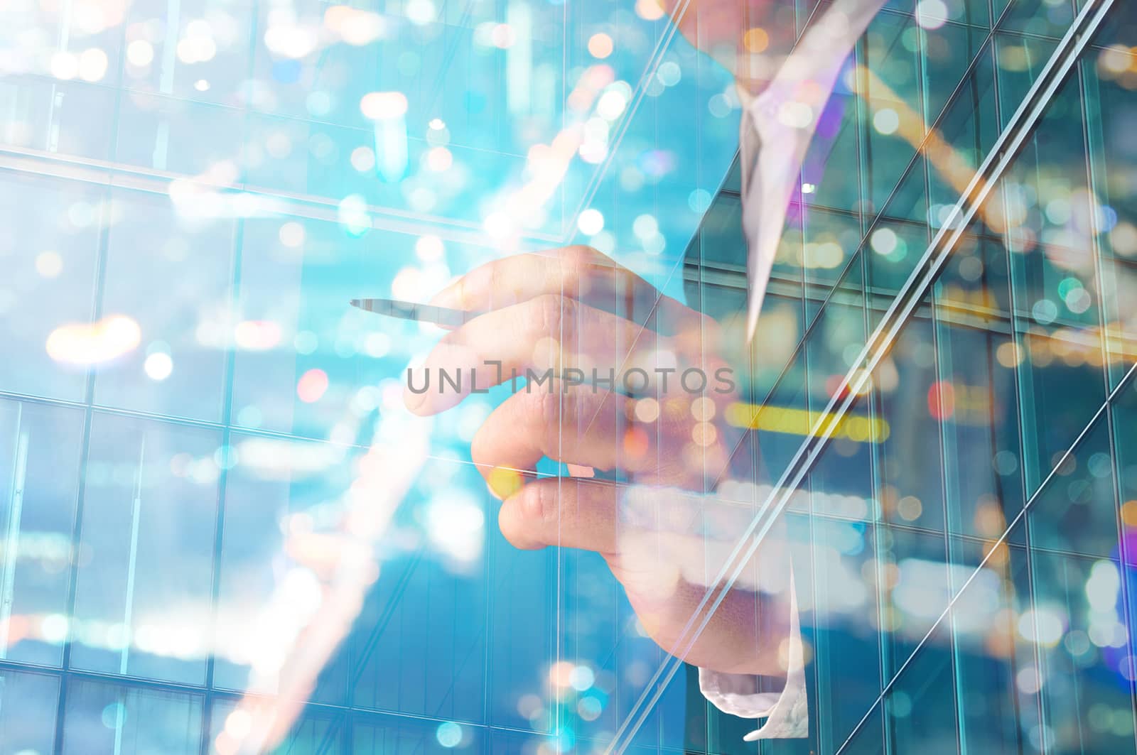 Double Exposure of Businessman writing with Building decorated with Glass