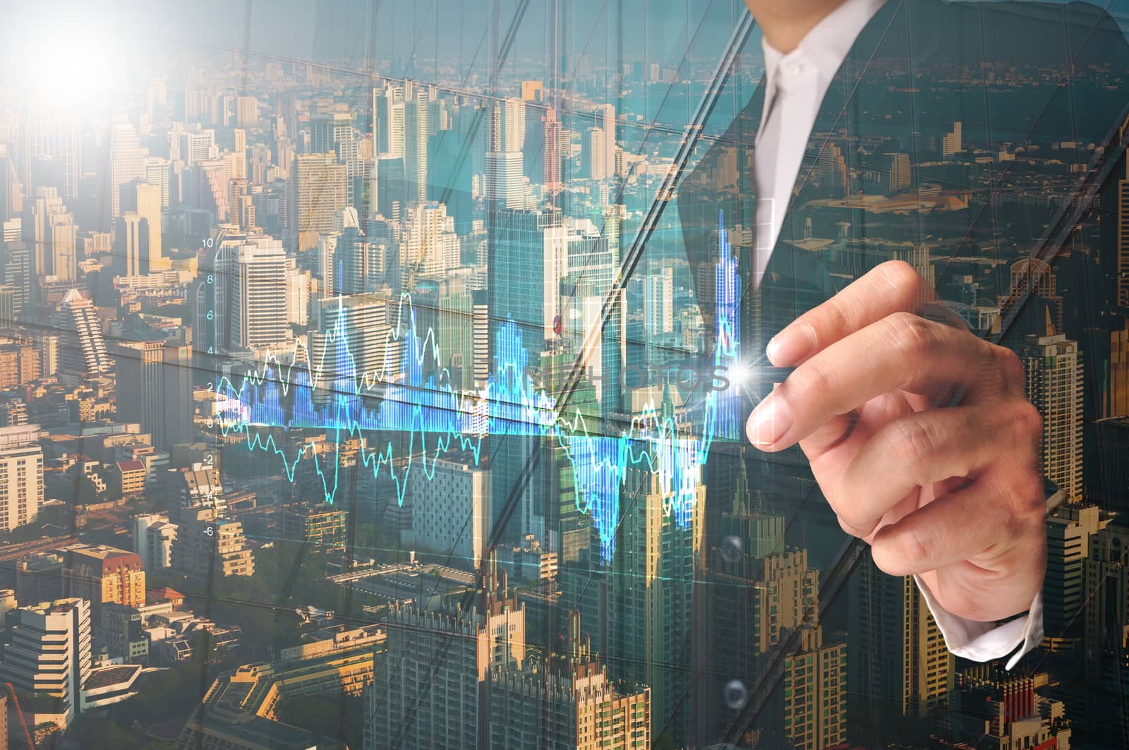 Double exposure of Businessman write analysis graph on Touch screen with Modern City reflection