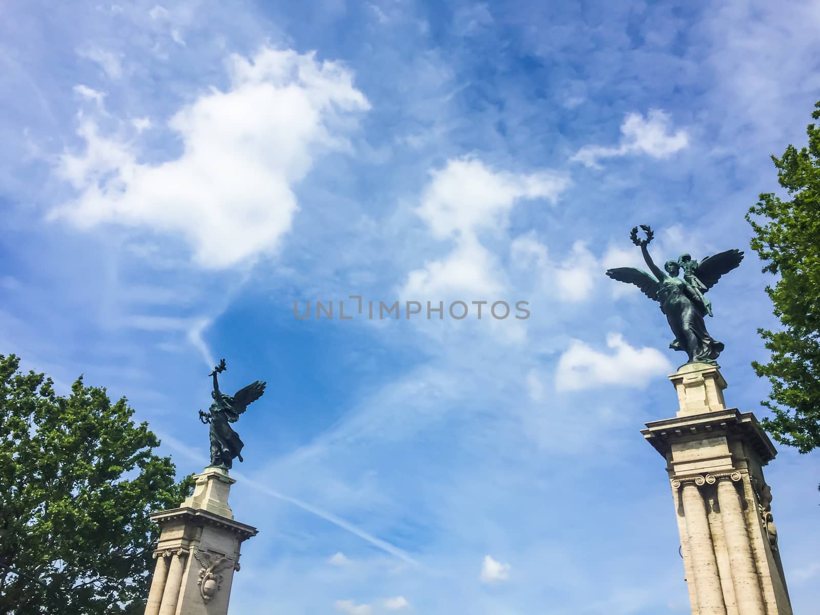 two colossal winged bronze statue on their high socles at the end of Ponte Vittorio Emanuele in Rome