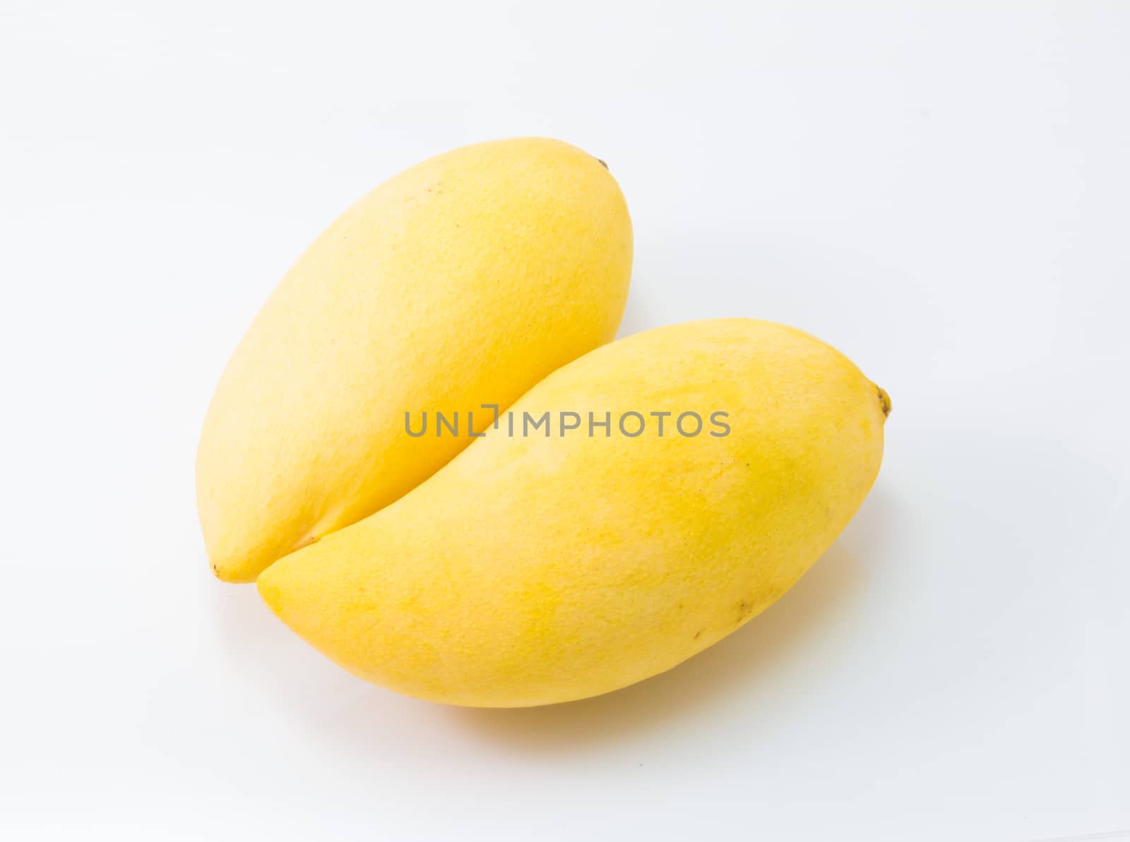 fresh delicious yellow mango isolated  on white background by chingraph