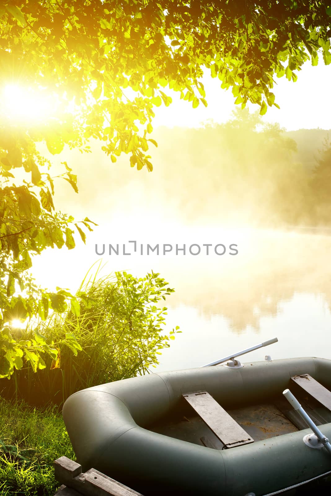 Inflatable fishing boat on the bank of a river