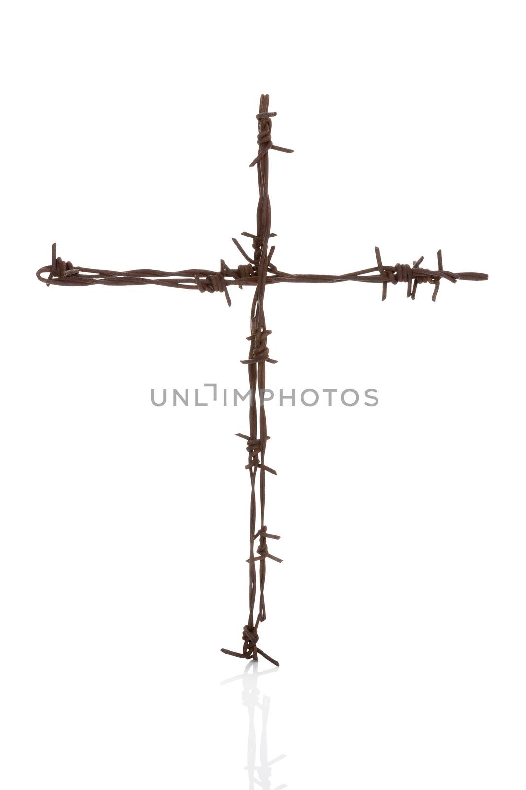 Religious war. Rusty barbwire cross isolated over white. 