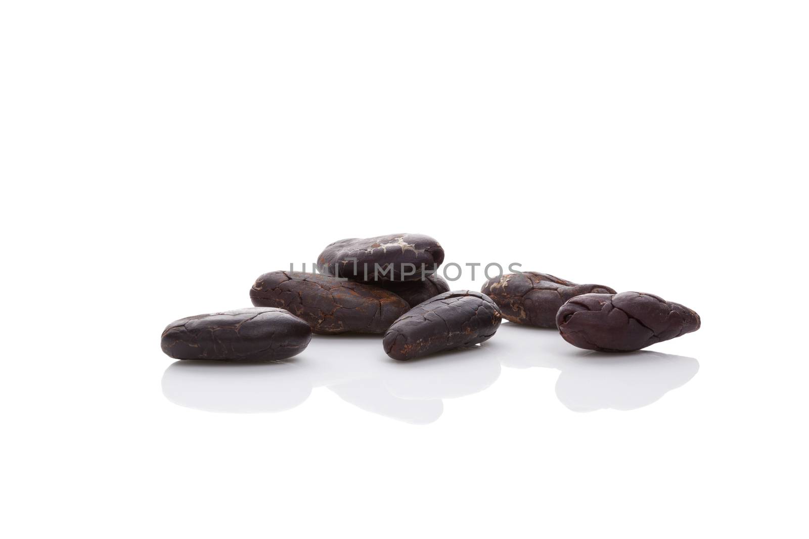 Cocoa beans isolated on white background.  by eskymaks