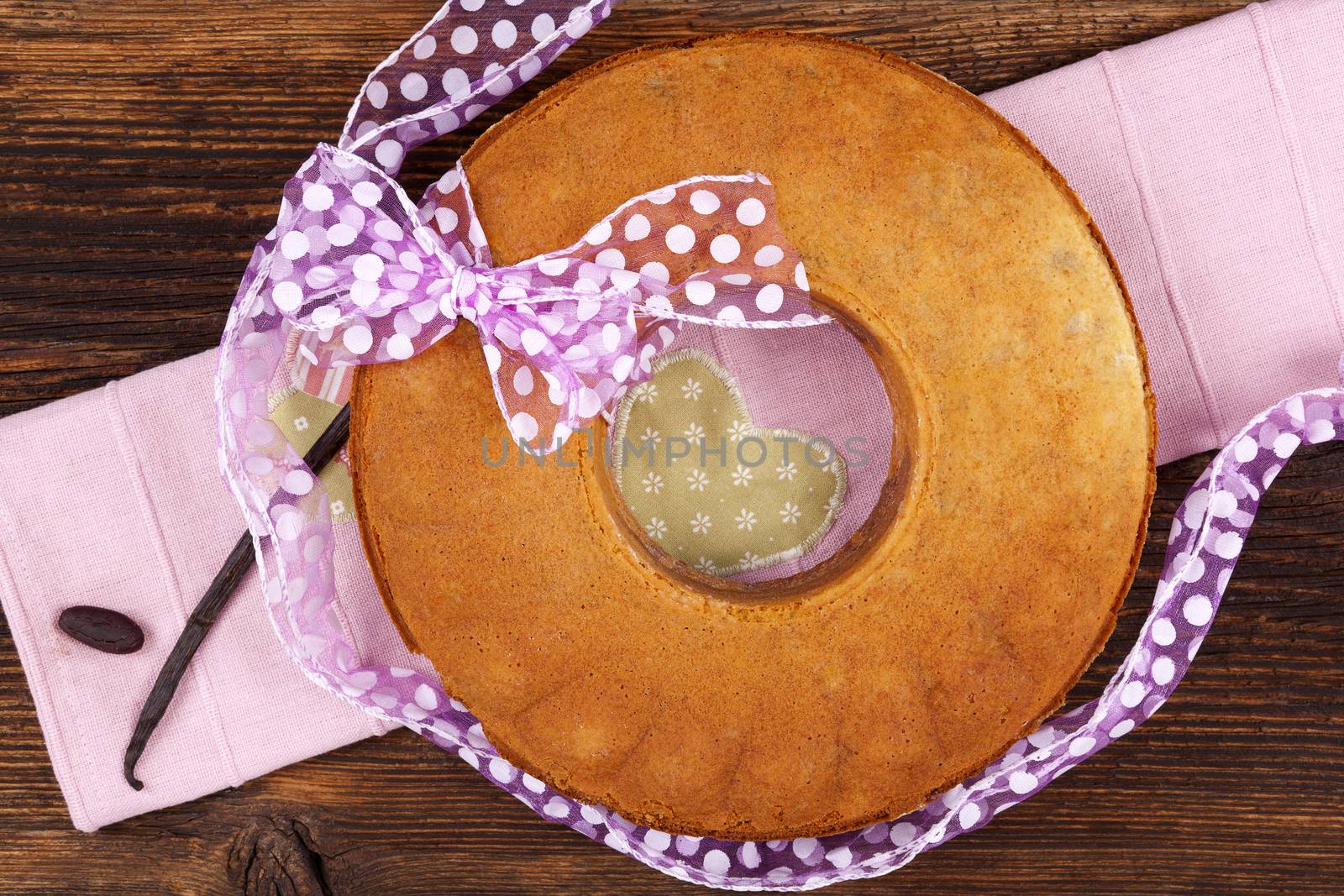 Delicious bundt cake on wooden table, top view. Traditional european sweet bundt cake.