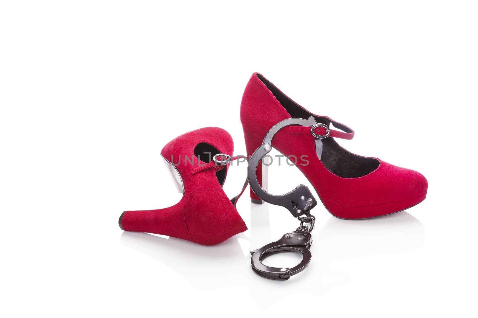 Red high heels and handcuffs. by eskymaks