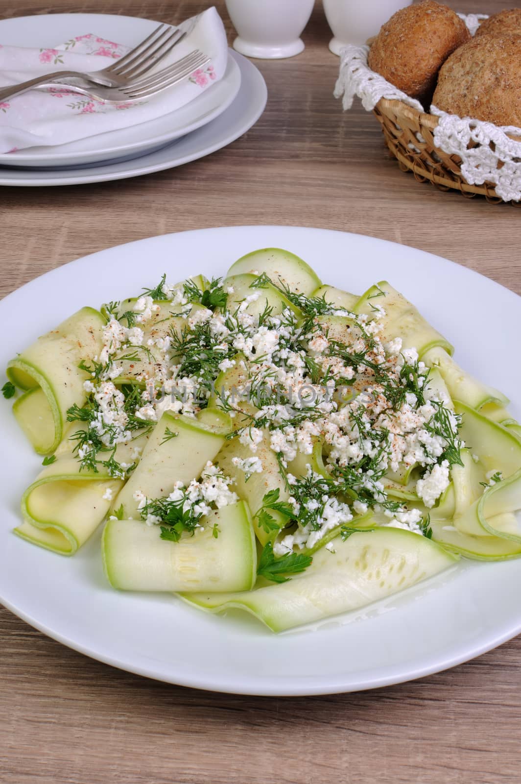 Salad with strips of zucchini, ricotta, dill and spices