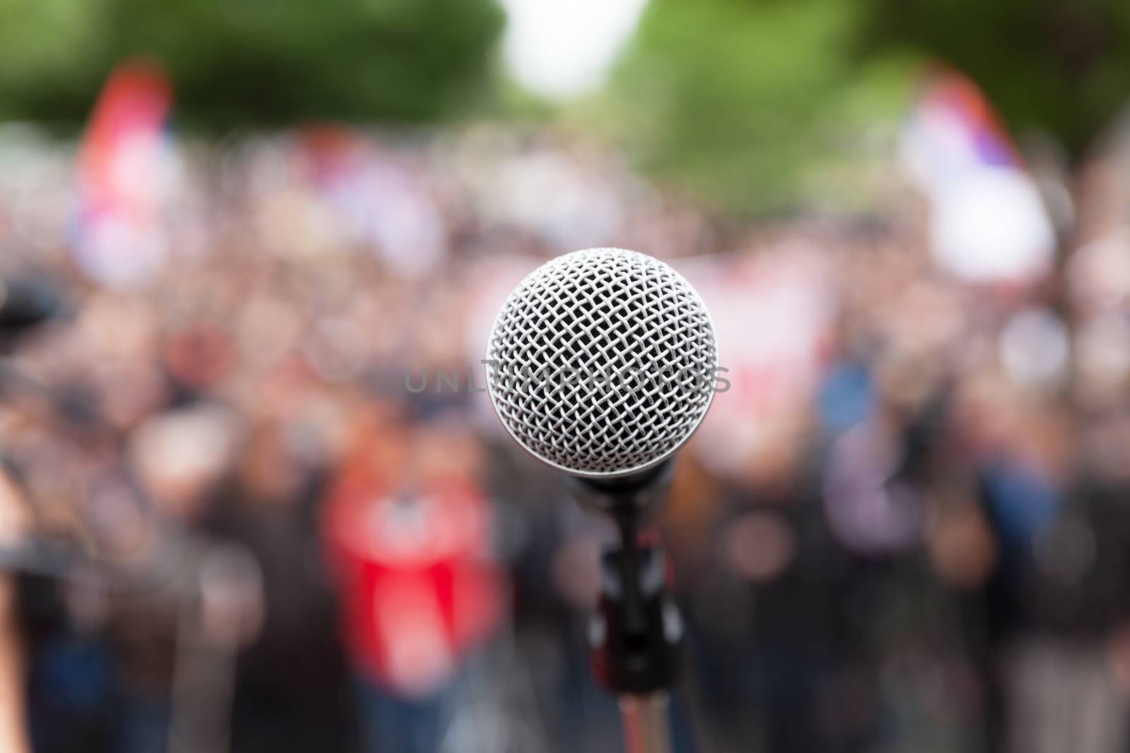 Political protest. Public demonstration. Microphone. by wellphoto