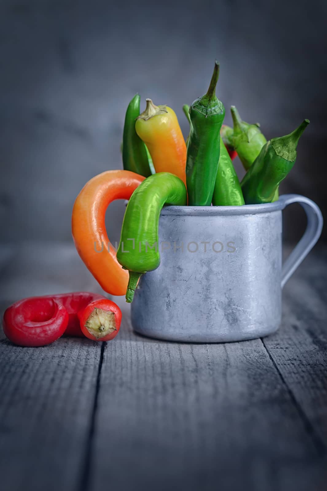 Chili pepper in a Cup on the table by Gaina