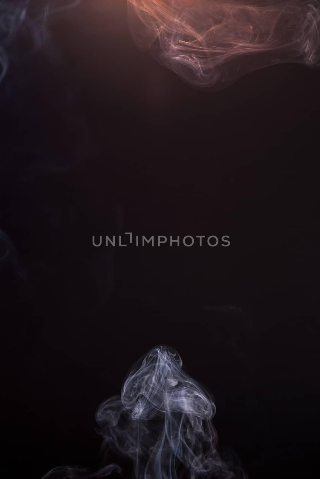 Beautiful smoke on the black background - macro photo by skrotov