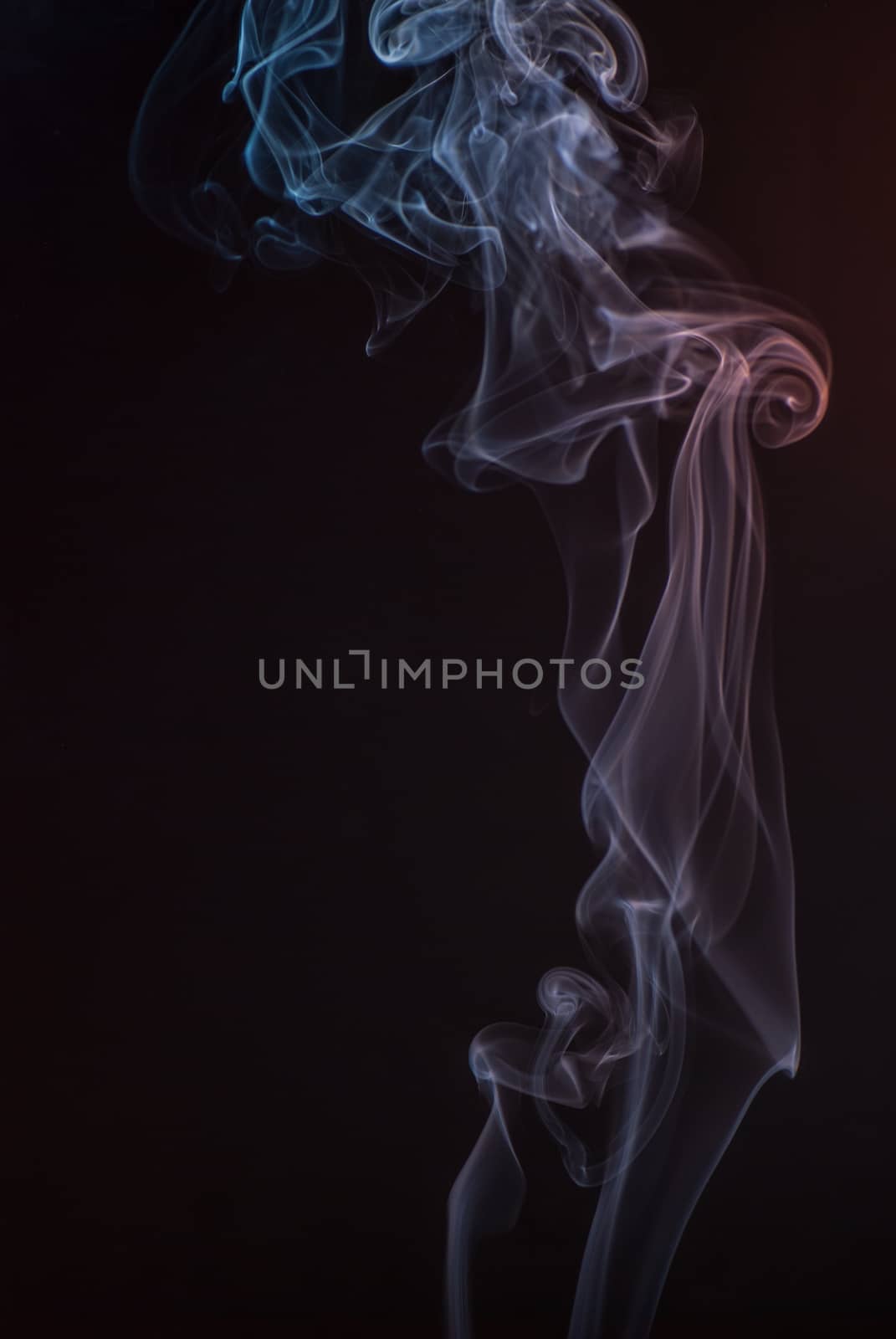 Beautiful smoke on the black background - macro photo by skrotov