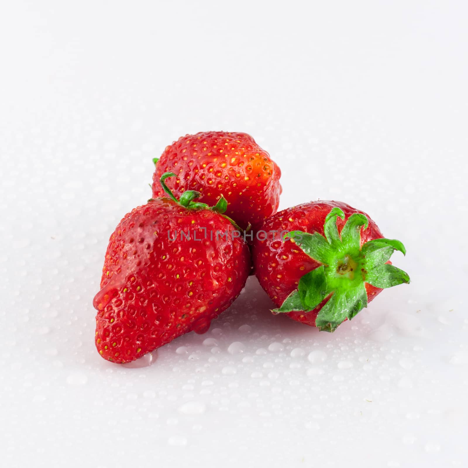 Closeup of strawberry with dew drops by replica