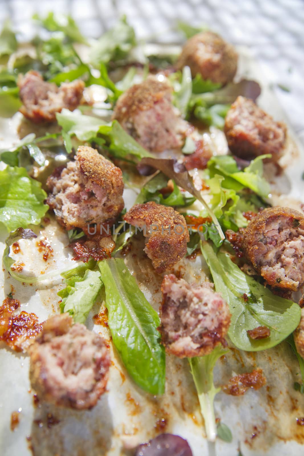 Second dish of meatballs and green salad