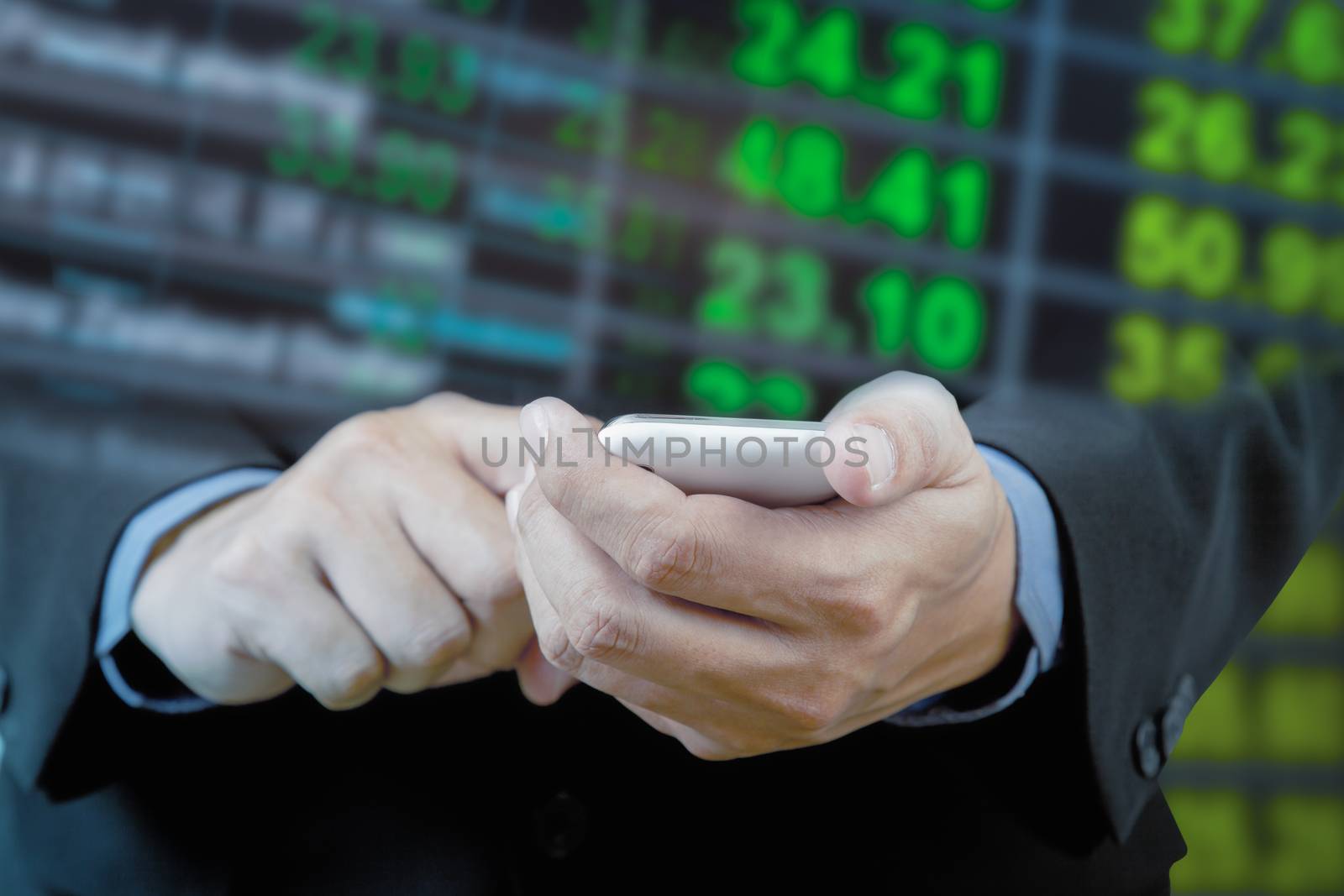 Businessman touch smart phone in hand with exchange rate blur background