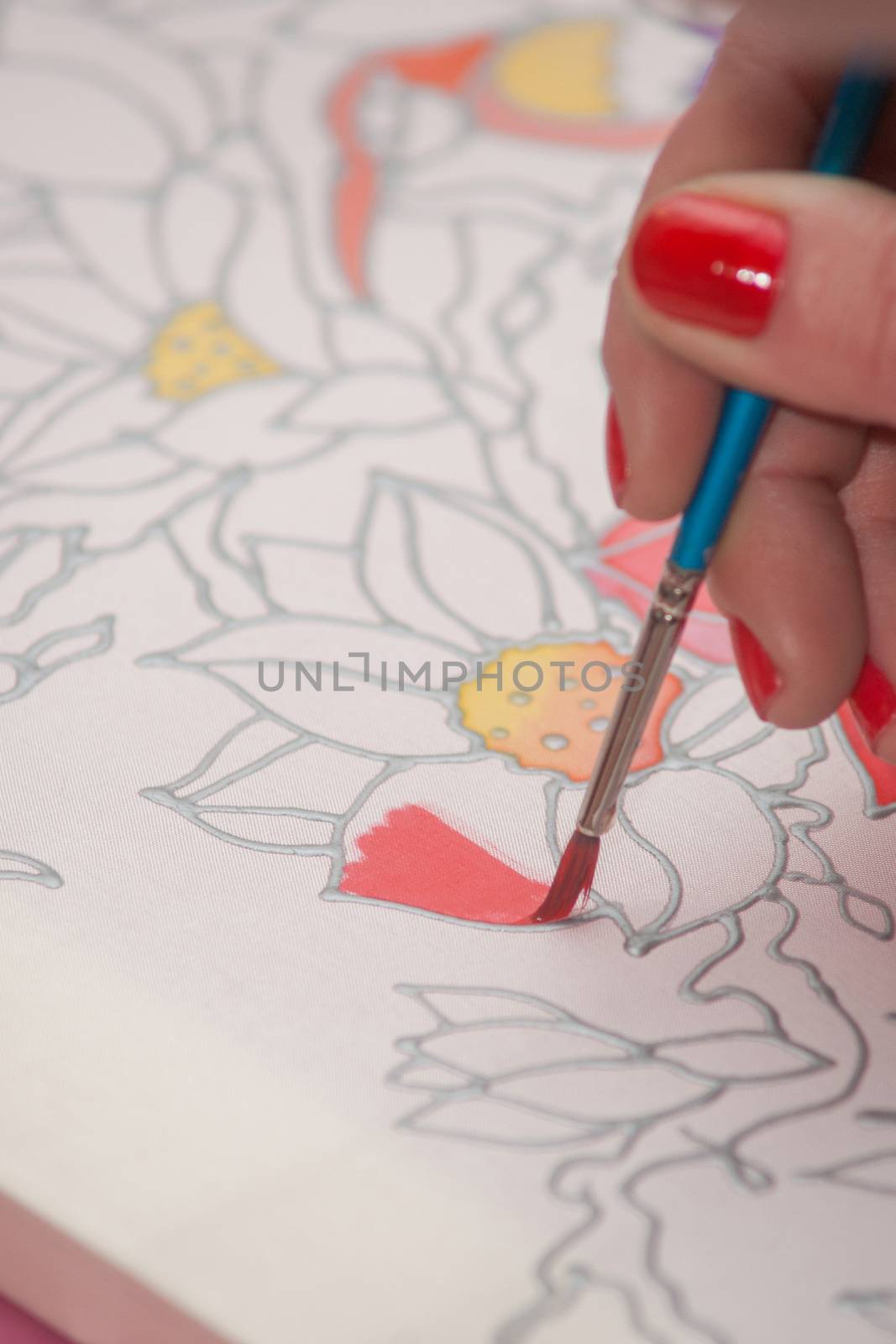 Woman hand with pencil is drawing picture by kozak