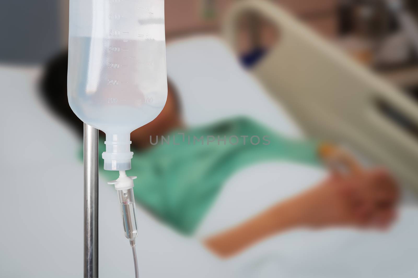 Infusion bottle with saline solution for patient in hospital roo by FrameAngel