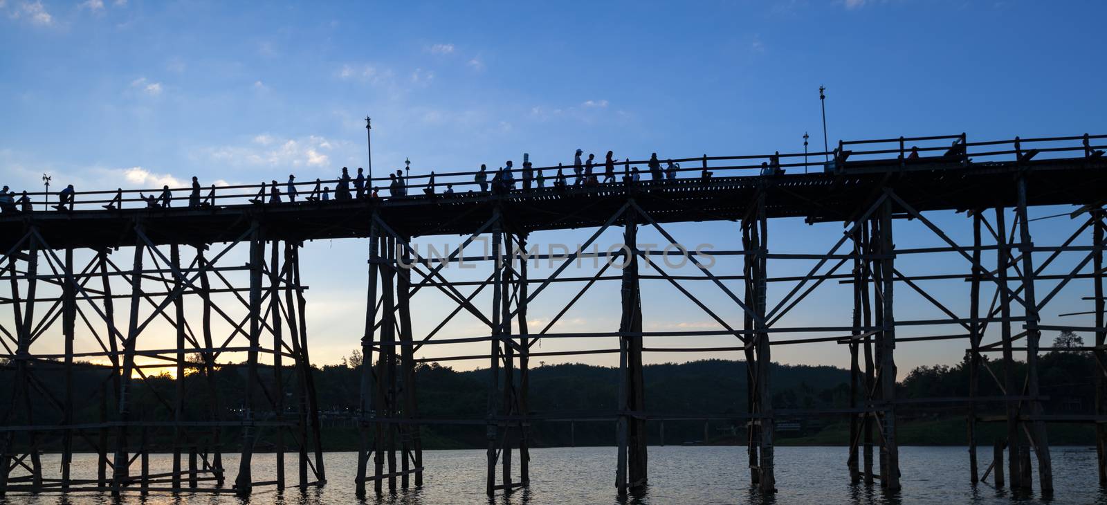 silhouette of Utamanusorn Bridge (Mon Bridge), made from wooden  by FrameAngel