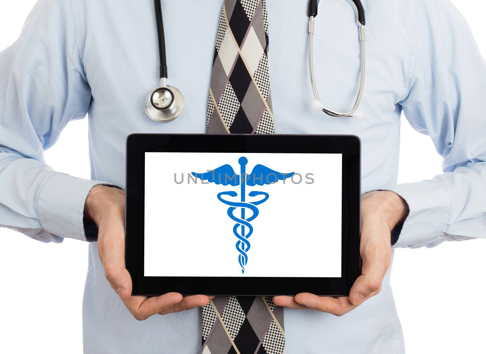 Doctor holding tablet - Caduceus symbol by michaklootwijk