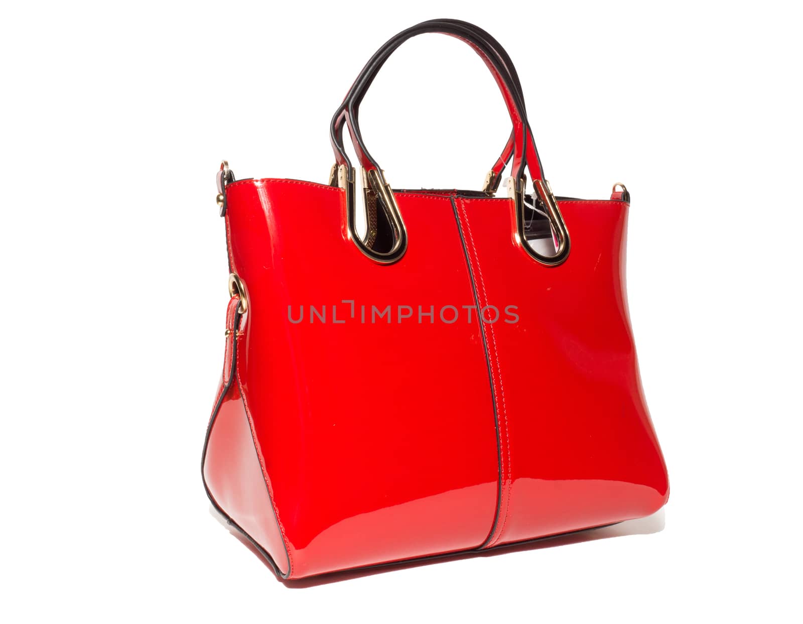 The photograph shows a female handbag on a white background