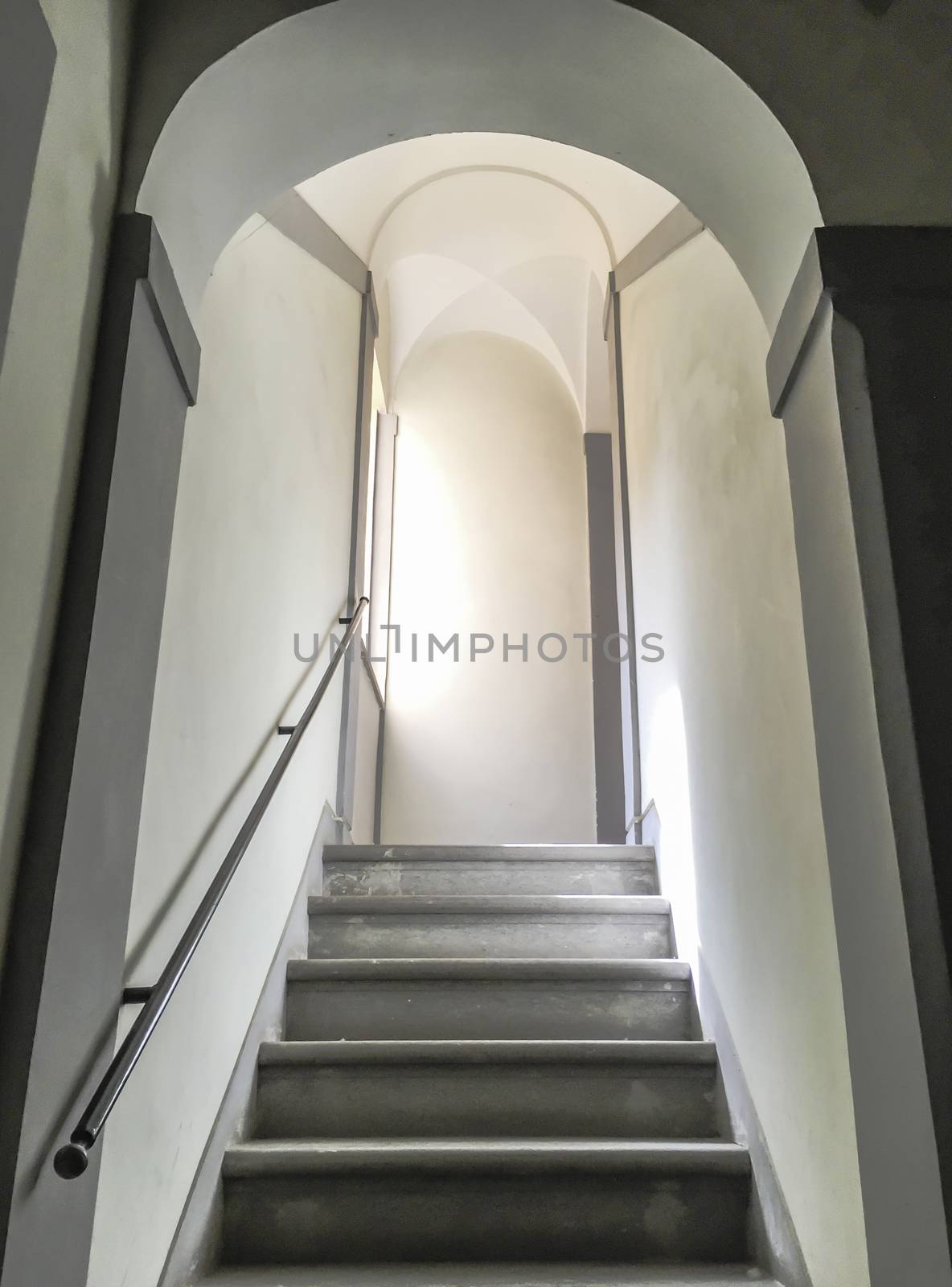 ancient stairway with sunlight on the left