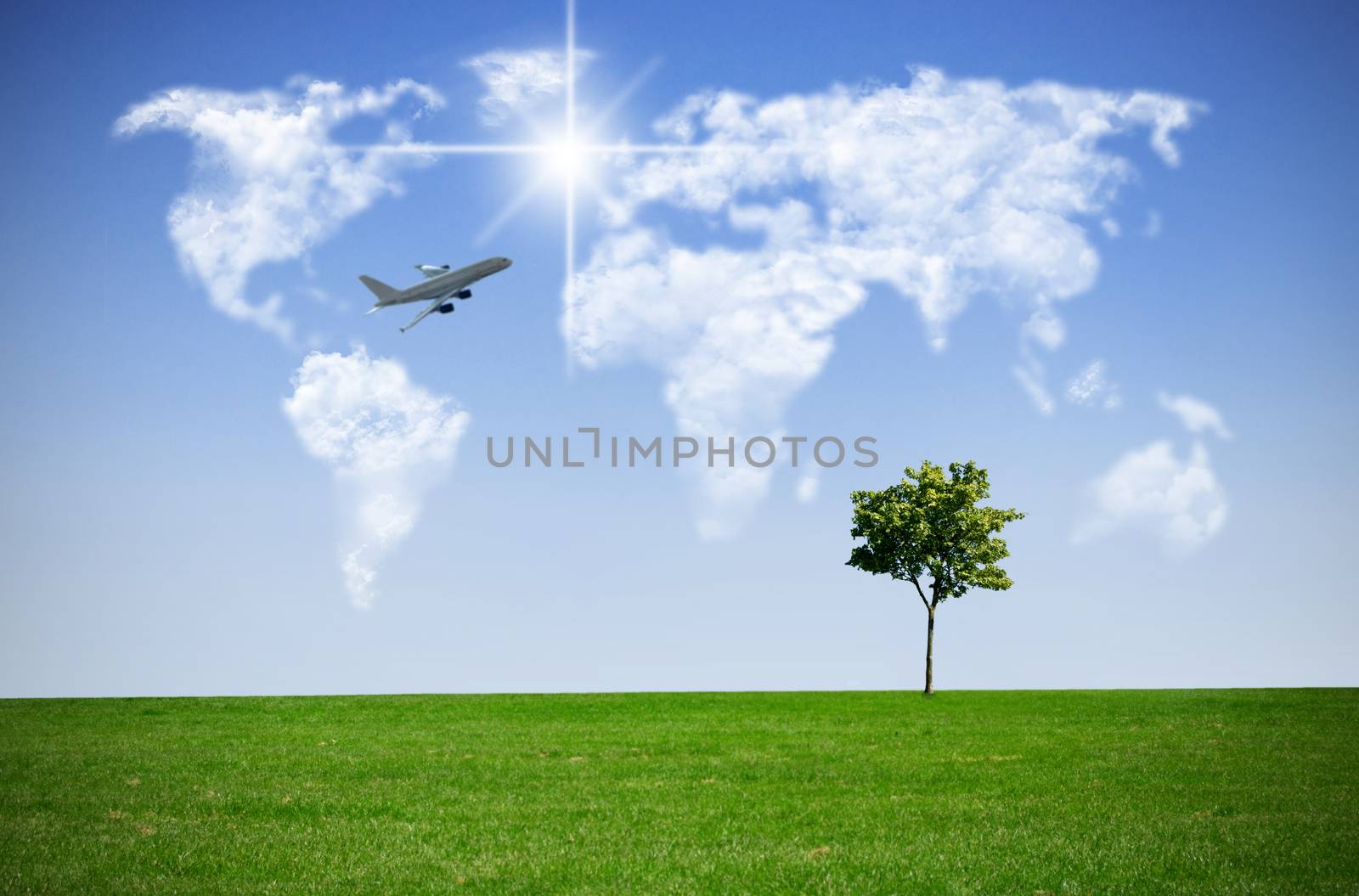 Clouds in the shape of a world map against blue sky with flying plane in the distance