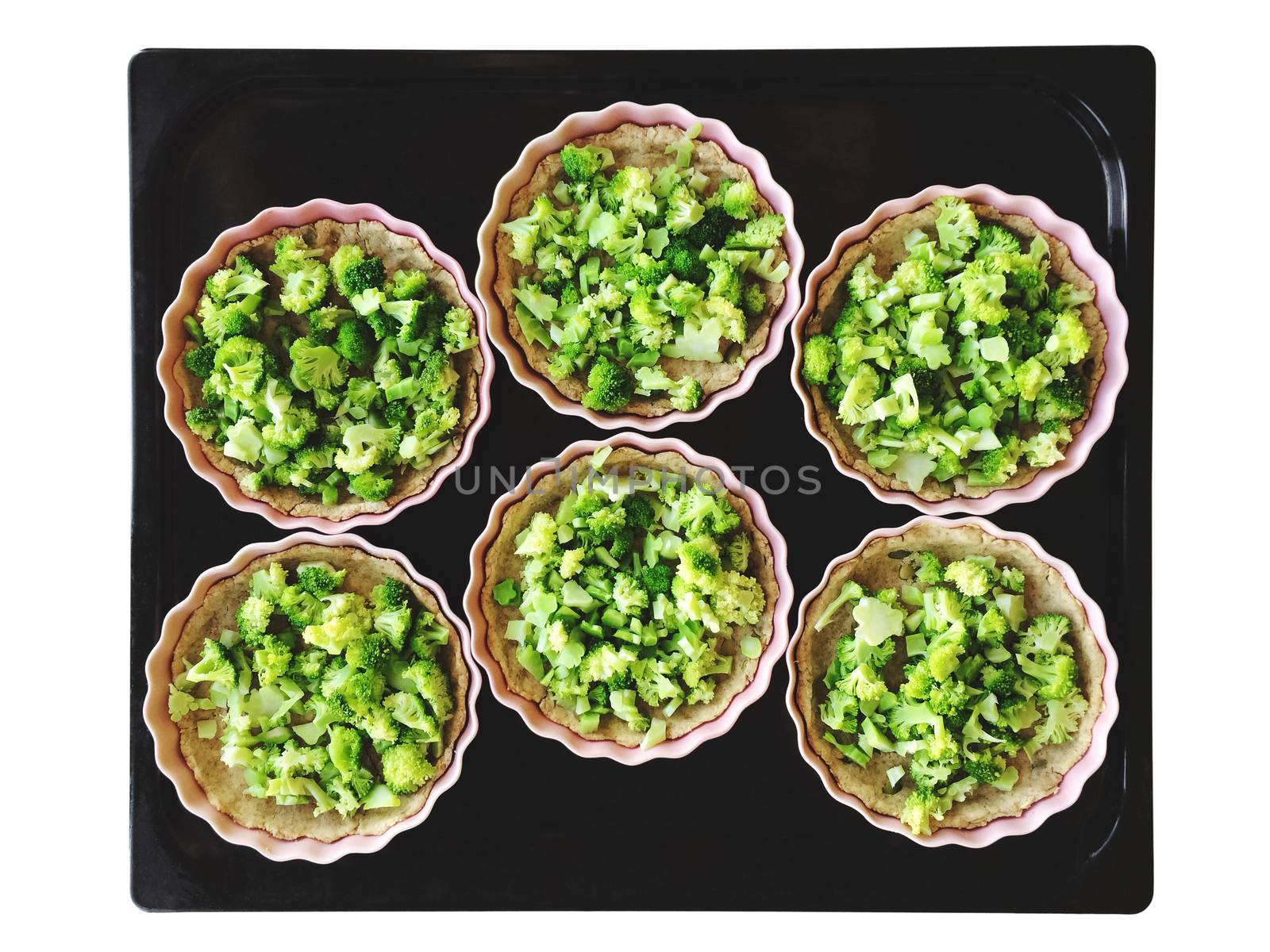 Broccoli pies on a baking tray by anikasalsera