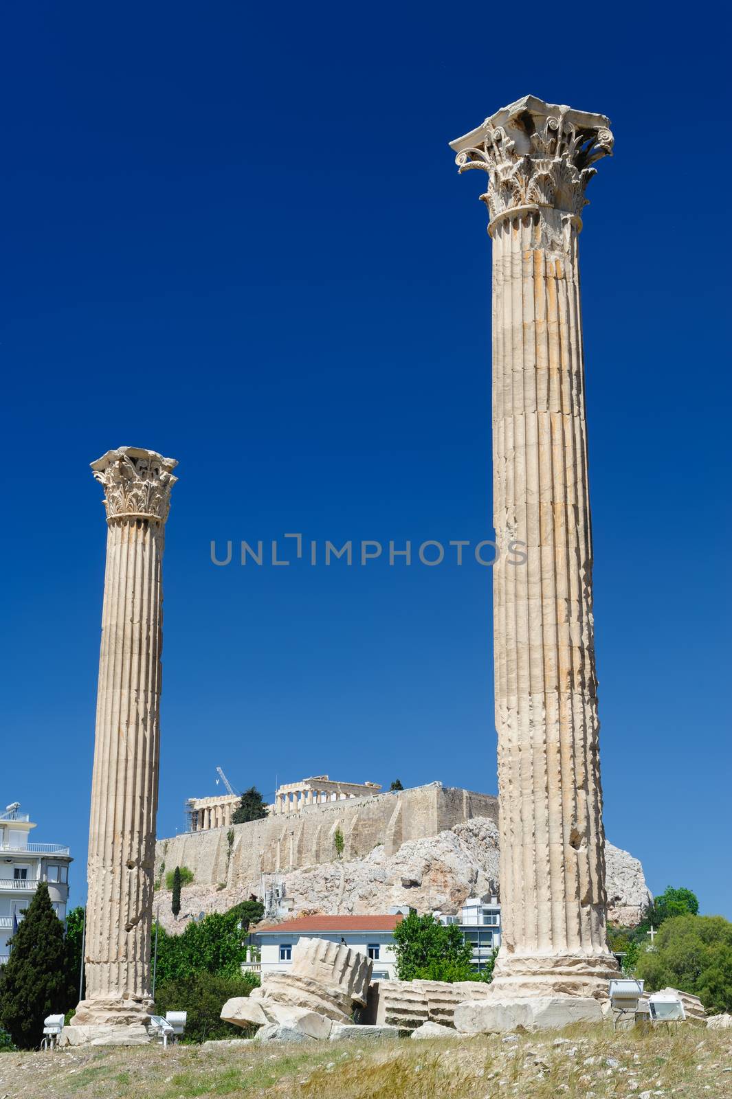 Olympeion, Ancient Temple of Olympian Zeus. Athens Greece. Acropolis at background.